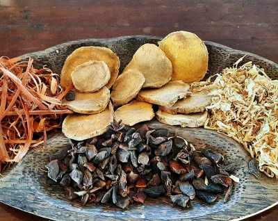 assortment of dried betel nuts and herbs.