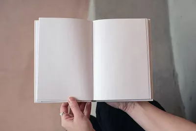 an open book with blank white pages.