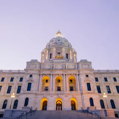 The Minnesota state capitol lit up at dusk.
