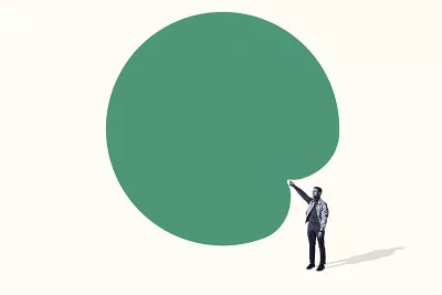 a person points toward a bank green bubble above their head.