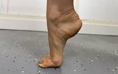 A foot standing only on its toes.