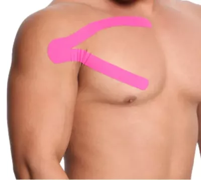 The final completed application of hot pink kinesio tape along the shoulder of a shirtless male client.