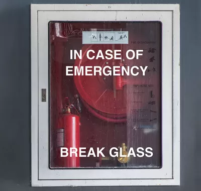 A glass fire case reads "in case of emergency break glass".