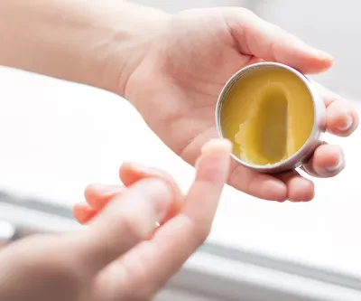 an herbal balm or salve in a small tin.