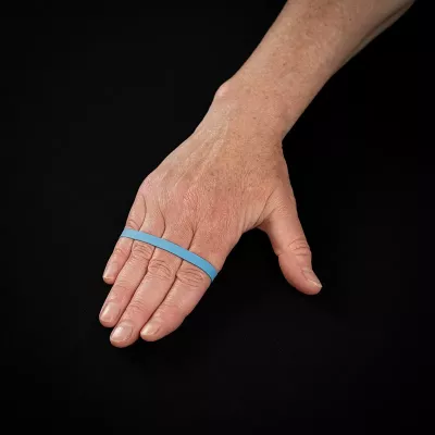 Repeating the exercise from Images 13 and 14 but with resistance by wrapping a rubber band around the fingers.