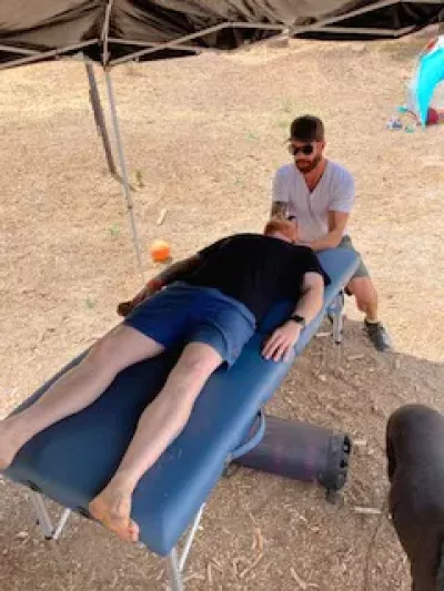 Shawn Shimkets performs massage on a fellow veteran.