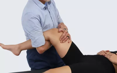 Massage therapist Erik Dalton demonstrates distract-compact the hip.