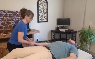 Cindy Williams demonstrates shaking technique on a male client.