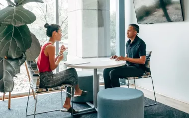 A man and woman conducting a job interview in an office setting.