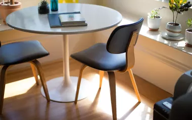 journals and notebooks sit on a round table.
