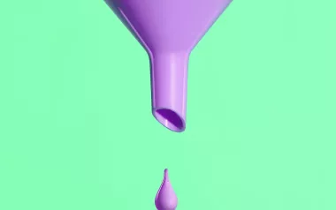 a large neon purple funnel with one droplet against a mint green background.