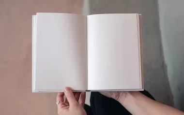 an open, blank white book.