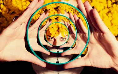 Reflection of woman in many mirrors.