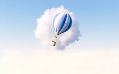 An illustration of a hot-air balloon passing in front of a cloud.