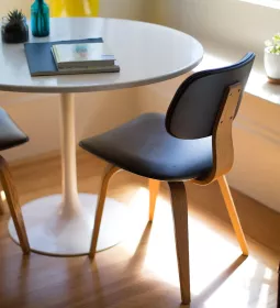 journals and notebooks sit on a round table.
