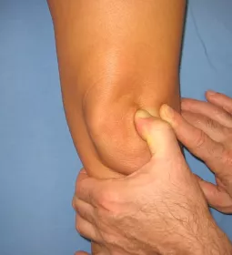 Lateral movement during massage as treatment for the patella.