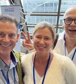 From left to right Til Luchau, Stephanie Otto, and Robert Schleip connect at the Fascia Research Congress in Montreal.