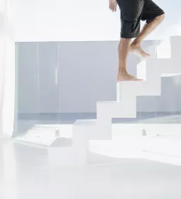 Man walking up steps.