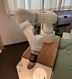 A robotic massage arm is displayed.