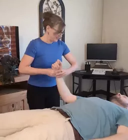 Cindy Williams, LMT, demonstrates oscillation technique on a male client.