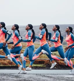 Stop-motion snapshot of a Black runner in neon colors, conveying movement.