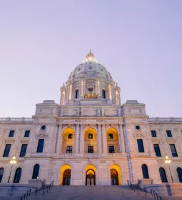 The Minnesota state capitol lit up at dusk.