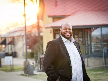 portrait of Terrance Bonner in a black suit jacket and white shirt.