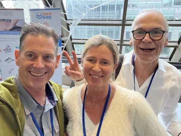 From left to right Til Luchau, Stephanie Otto, and Robert Schleip connect at the Fascia Research Congress in Montreal.