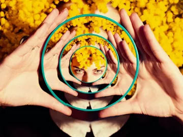 Reflection of woman in many mirrors.