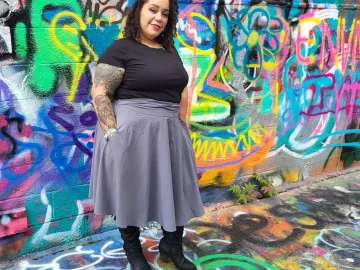 Leslie DeJesus poses for a photo in Graffitti Alley in Baltimore. 