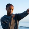 A woman throws a punch.