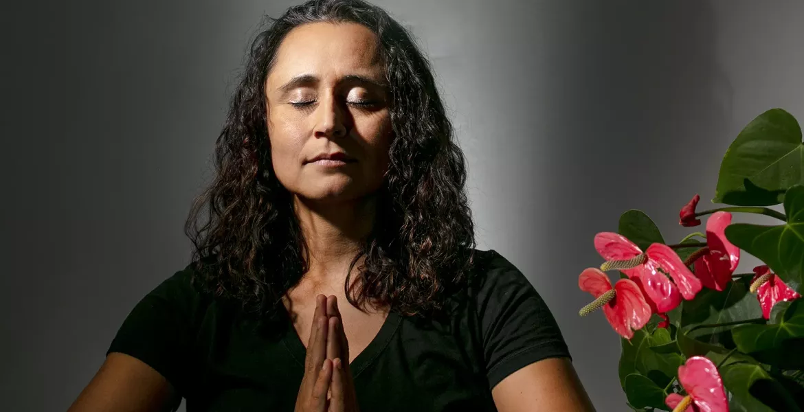 Stormy Mesa in a meditative pose.